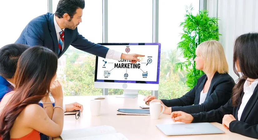 Team of B2B marketing experts discussing content marketing strategies to drive business growth - Revenue Growth Services